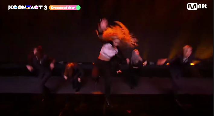 Handong leaping into the air hair streaming during Dreamcacther's performance of My House