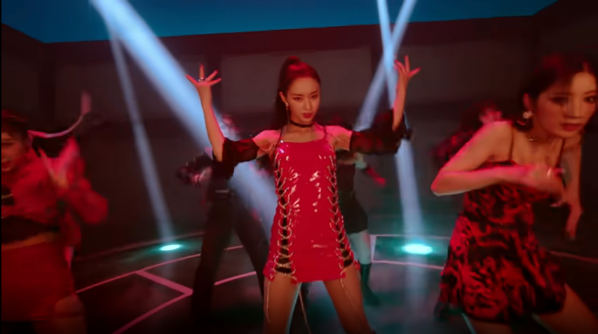 Park Jieun in a red outfit in the Purple Kiss memeM music video